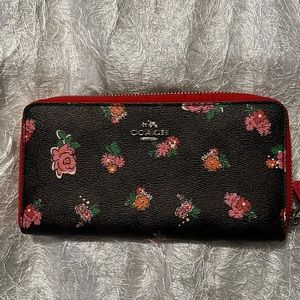 Multi brown and red floral coach wallet.